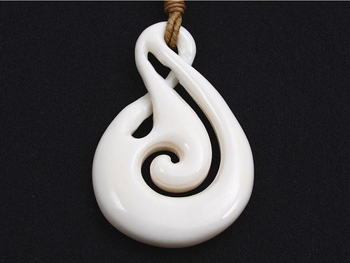 Premier twist and koru bone pendant
