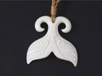 Premier whale-tail bone pendant
